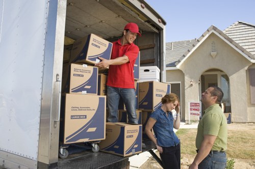 Professional unpacking service arranging furniture