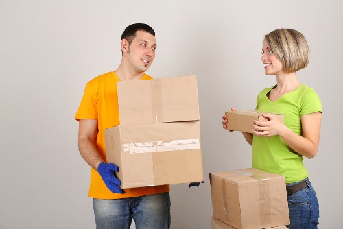 Professional movers loading furniture in Brixton